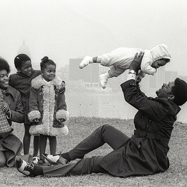 Eugene (Gene) Parks with his wife and children relaxing outdoors. From left to right are Kendra Parks, Marilyn Park, Wendy Parks, Stacey Parks, Reggie Parks (the baby) and Eugene Parks. Parks had a long career in Madison politics, often as a champion of civil rights issues. He was president of the local NAACP chapter from 1975-1979.